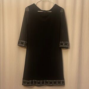 Chic Black Dress with Embellished Sleeves